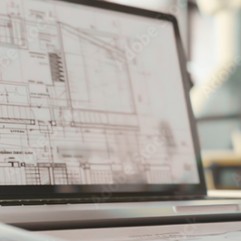 Architectural drawings on a laptop screen